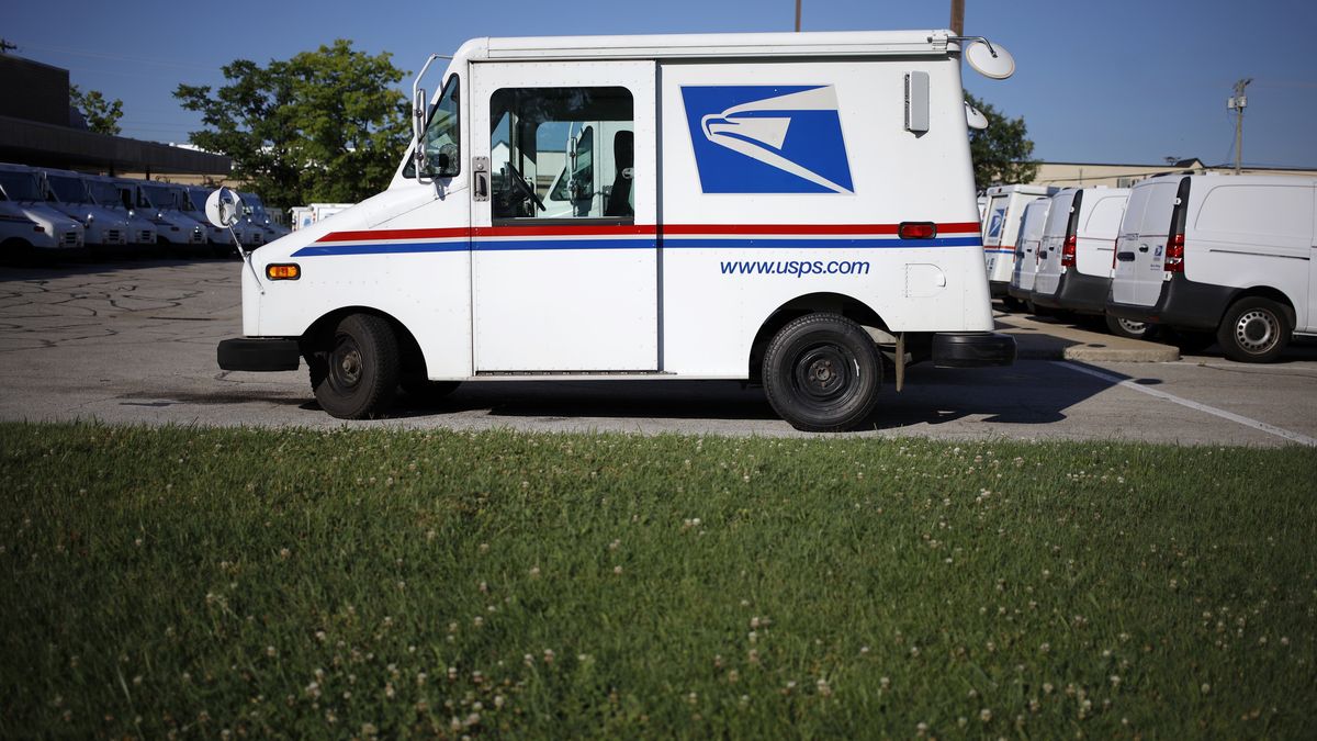 United States Postal Service (USPS) mail delivery vehicles outside a post office in Louisville, Kentucky, US, on Sunday, July 3, 2022. Beginning July 10, the cost of postage stamps will increase from 58 cents to 60 cents, and the cost to mail one metered mail piece will increase from 53 cents to 57 cents. Photographer: Luke Sharrett/Bloomberg via Getty Images