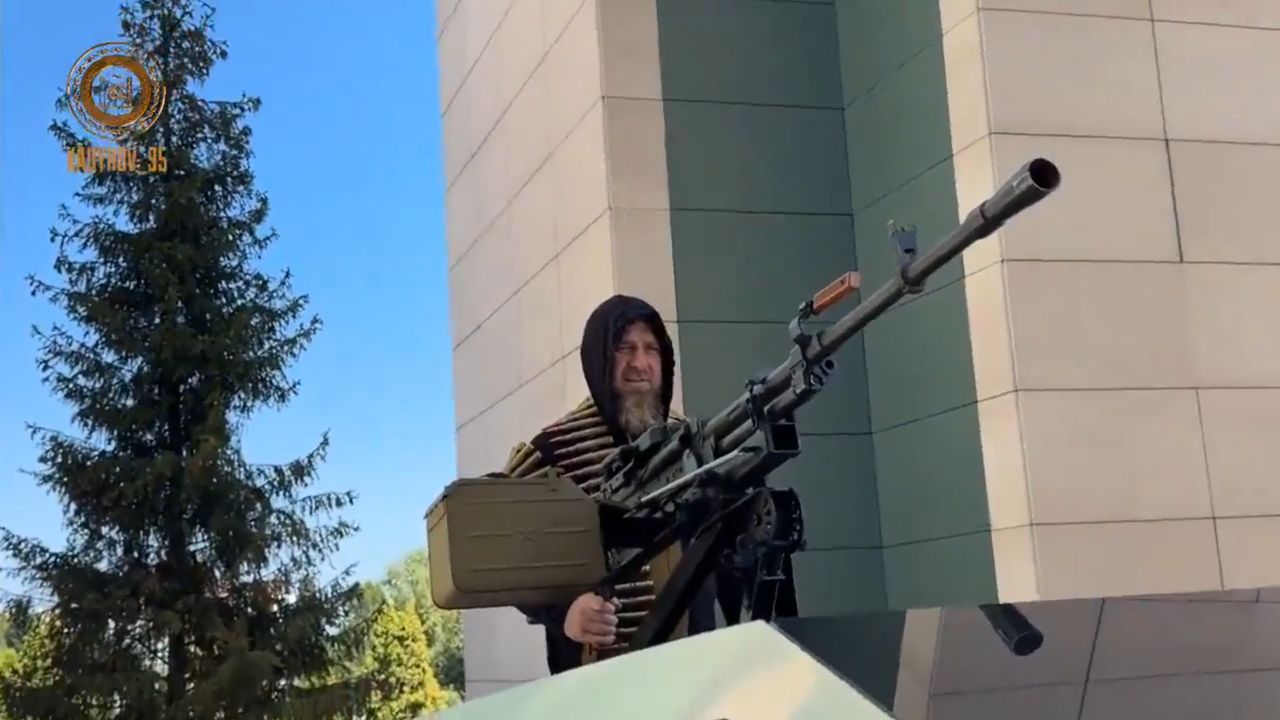 Razman Kadyrow on the back of a Tesla Cybertruck with a mounted Kord heavy machine gun.