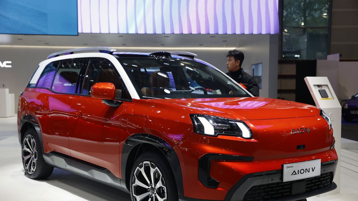 PARIS, FRANCE - OCTOBER 15: A Gac Aion V Electric automobile is on display during the "Mondial de l'Auto" at the Parc des Expositions on October 15, 2024 in Paris, France. The 90th Paris Motor Show 2024 opened its doors on Monday, against the backdrop of the automotive crisis, due to the electrification of the European sector and competition from Chinese carmakers. The event is open to the public from October 15 to 20 at Paris Expo Porte de Versailles (Photo by Chesnot/Getty Images)