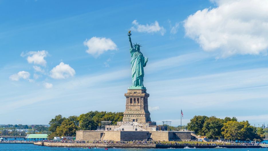 Deposit Photos 2024-12-11
World famous Statue of Liberty under a blue sky with clouds. New York City, USA