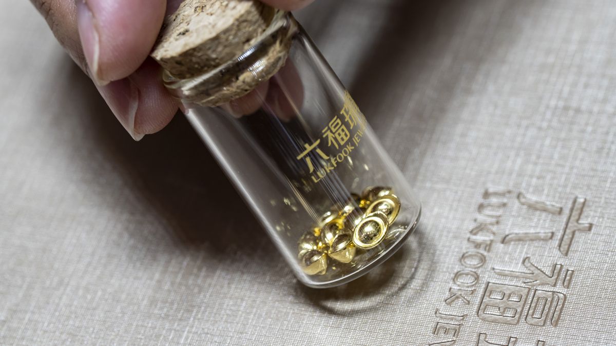 Gold beans for sale inside a Luk Fook Holdings International Ltd. jewelry store in Shanghai, China, on Wednesday, March 13, 2024. Weighing as little as one gram, the beans  and other forms of gold jewelry  are increasingly viewed as the safest investment bet for young Chinese in an era of economic uncertainty. Photographer: Qilai Shen/Bloomberg via Getty Images