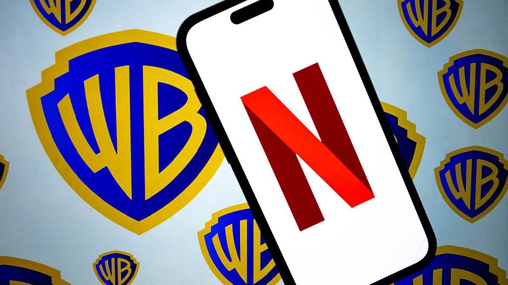 Netflix - Warner Bros
ANKARA, TURKIYE - DECEMBER 5: In this photo illustration, the logo of Netflix is displayed on a mobile phone screen in front of the logo of Warner Bros in Ankara, Turkiye on December 5, 2025. (Photo by Didem Mente/Anadolu via Getty Images)
Anadolu
generativeai, filmmaking, platform, recommendationalgorithm, licensing, animation, digitalcontent, cinema, hollywood, partnerships, binge-watch, branding, globaldistribution, intellectualproperty, franchiseworld, contentstrategy, blockbuster, contentlibrary, entertainment, ottplatforms, postproduction, series, on-demand, digital, ondemandsubscriptions, stock photo, movies, originals, stockfootage, franchise, cinematicuniverse, content, media, screenwriting, stock photos, brand, audienceinsights, algorithmiccuration, distribution, production, filmrights, globalaudience, ipdevelopment