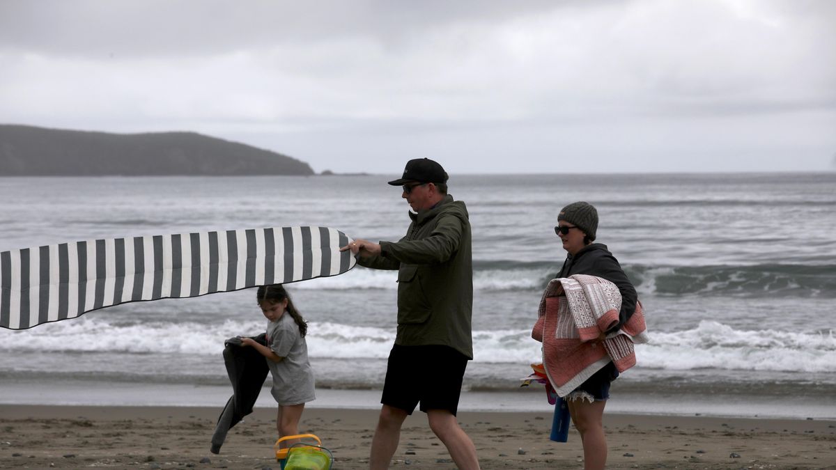 DILLON BEACH, CA - APRIL 24, 2024 - Nevada City residents Cameron E., 39, his wife Jessica, 42, and daughter Jo, 8, get ready to spend the day at Dillon Beach on April 24, 2024. The family are renting a house in Dillon Beach.  Dillon Beach has allowed more rentals than other area in West Marin County.
West Marin County, home to some of California's most beautiful beaches and most expensive homes, is putting a cap on short-term rentals. Proponents of the cap say Airbnbs have ruined small towns, eating valuable housing stock and making it devoid of actual locals. Opponents say it's so expensive anyway that a vacation rental ban doesn't add affordable housing. This had to go before the California Coastal Commission who proposed regulations would maintain visitor access to the coast while preventing the further erosion of West Marin's year-round supply of rental housing. (Genaro Molina/Los Angeles Times via Getty Images)