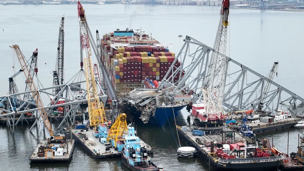 Recovery Efforts Continue At The Site Of The Francis Scott Key Bridge Collapse In Baltimore
BALTIMORE, MARYLAND - MAY 08:  In this aerial view, salvage crews continue to remove wreckage from the Dali six weeks after the cargo ship collided with the Francis Scott Key Bridge May 08, 2024 in Baltimore, Maryland. Officials announced this week that precision explosive charges will be used to separate the Dali from the spans of the bridge that collapsed over its bow which should make it possible to move the ship and open a 45-foot channel in the Patapsco River. Salvage teams on Tuesday found remains of construction worker Jose Minor Lopez, the final missing victim of the March 26 collapse. (Photo by Chip Somodevilla/Getty Images)
Chip Somodevilla