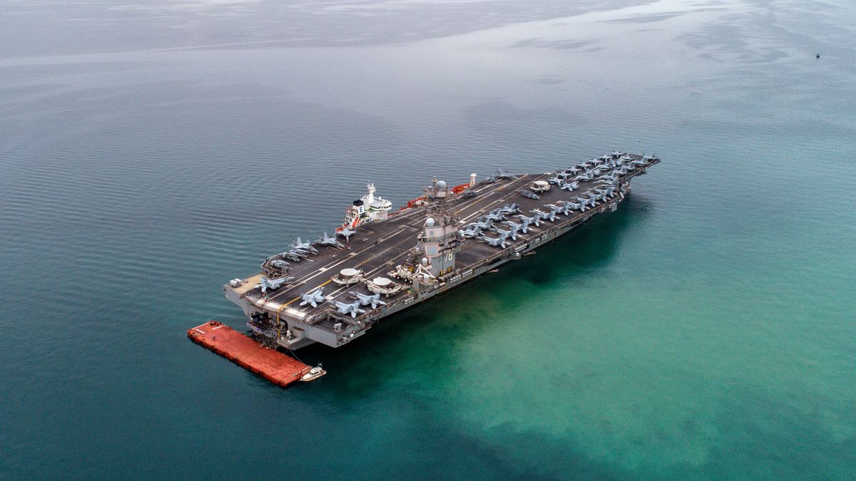 TRIESTE, ITALY - 2023/09/18: EDITOR'S NOTE: (Image taken with a drone)
American aircraft carrier USS Gerald R. Ford is seen from the air anchored in Italy in the Gulf of Trieste. The USS Gerald R. Ford is the largest warship in the world. (Photo by Andrej Tarfila/SOPA Images/LightRocket via Getty Images)