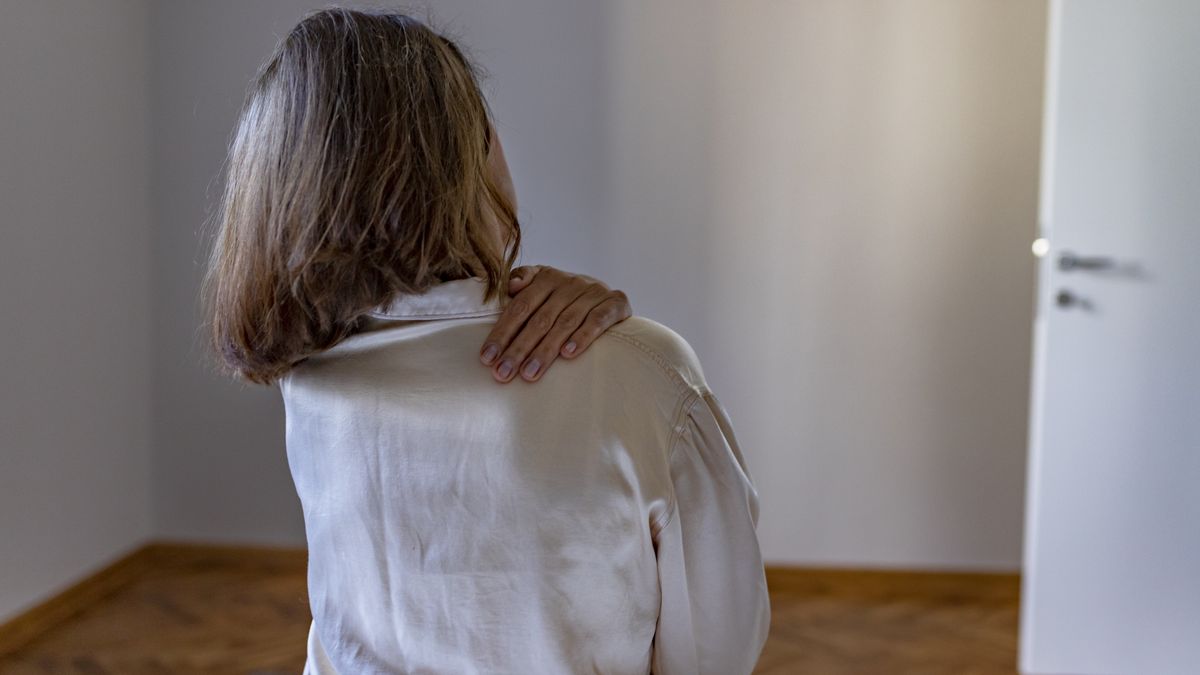 Back pain in elderly personSenior Woman Suffering From Backache in Morning Sitting on Bed, Panorama With Free Space. Back Pain in Elderly Person. Woman Feels Back Pain Massaging Aching Muscles. Mature Woman Feeling Morning Discomfort in Aching Back in the Bedroom.PixelsEffect