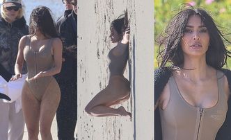 Smagana wiatrem Kim Kardashian eksponuje podrasowane kształty na plaży, reklamując swoje kostiumy (ZDJĘCIA)