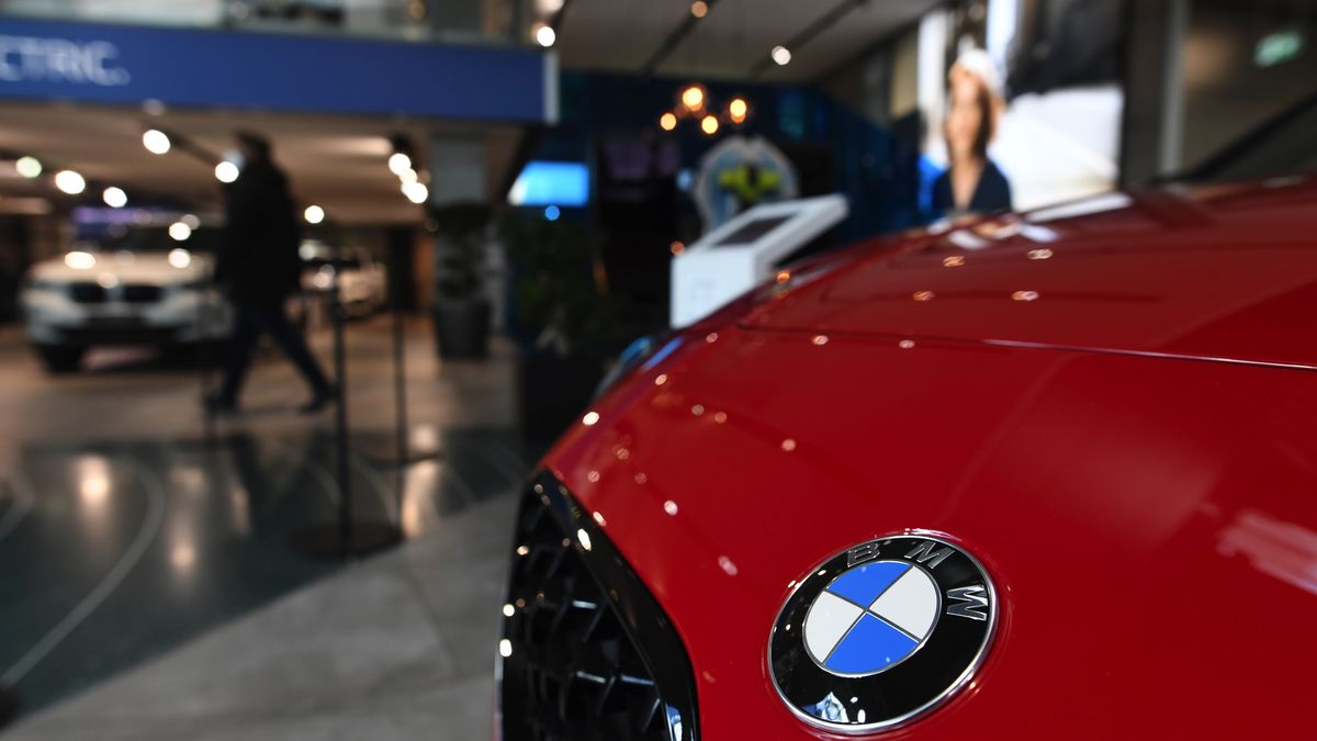 A badge on the hood of a new BMW automobile at the BMW Welt showroom, operated by Bayerische Motoren Werke AG, in Munich, Germany, on Friday, March 12, 2021. BMW expects profit to rise this year, building on positive momentum from late last year when sales recovered in key regions. Photographer: Andreas Gebert/Bloomberg via Getty Images