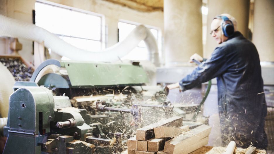 Mint Images RF batch 62 July 2016
Man standing in a carpentry workshop, wearing hearing protectors, working at a woodworking machine.
Mint Images