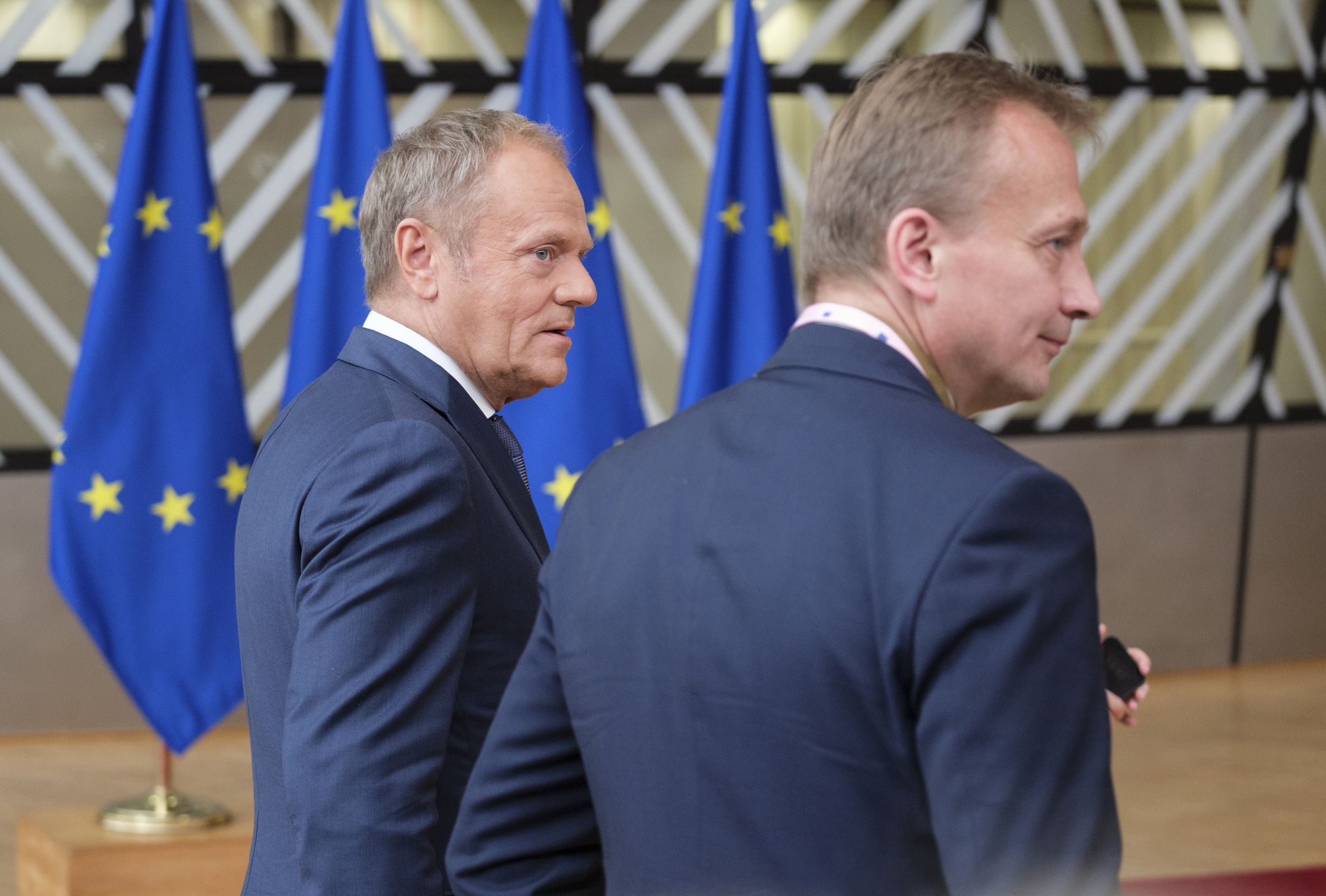BRUSSELS, BELGIUM - JUNE 27: Polish Prime Minister Donald Tusk talks to the media in the Europa building on June 27, 2024 in Brussels, Belgium. The meeting will be an opportunity to discuss the situation on the ground, but also take note of some achievements since the last meeting. Polish PM is flanked by the Acting Permanent Representative of Poland Piotr Serafin. (Photo by Thierry Monasse/Getty Images)