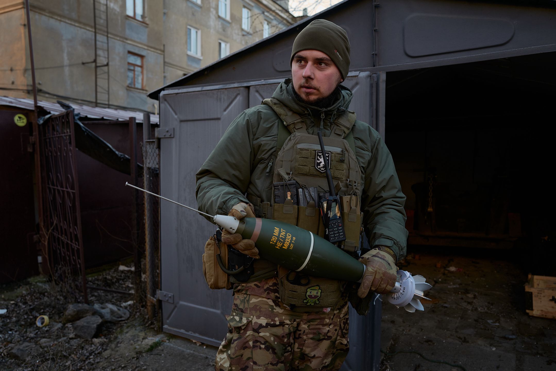 BAKHMUT, UKRAINE - DECEMBER 20: A Ukrainian soldier of a special forces unit holds a 120 mm mortar shell amid artillery fights on December 20, 2022 in Bakhmut, Ukraine. According to the office of the Ukrainian president, Volodymyr Zelenskiy has visited the frontline city of Bakhmut to meet military representatives and hand out awards to soldiers. (Photo by Pierre Crom/Getty Images)