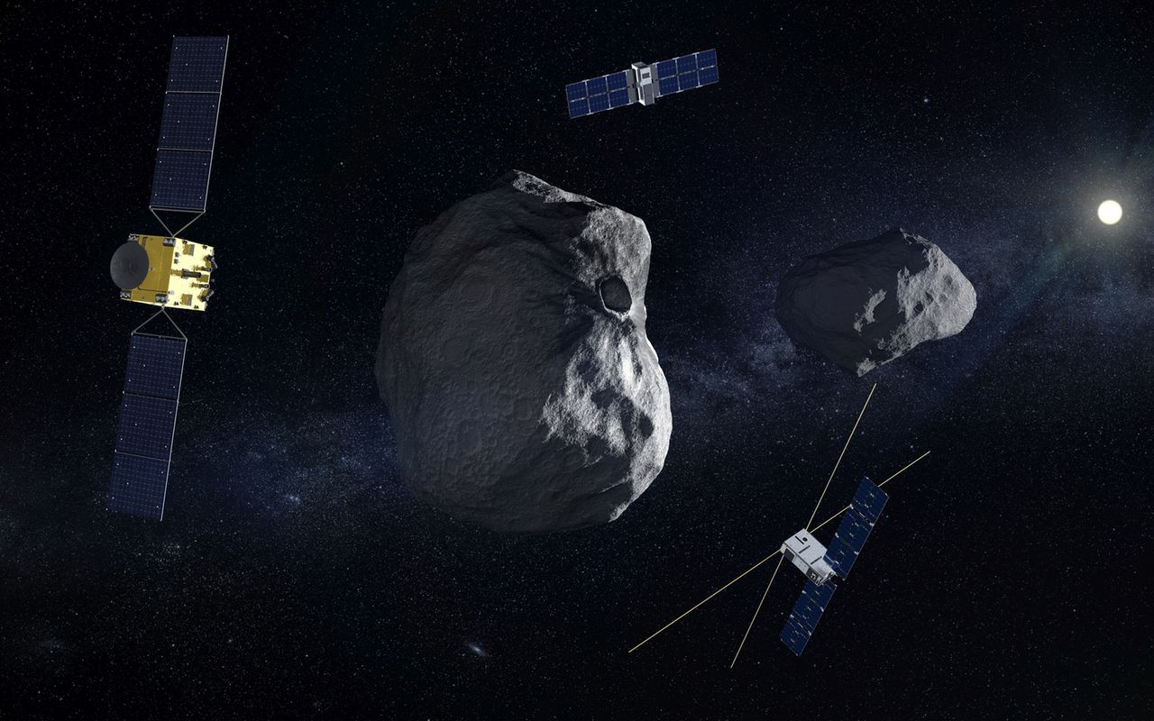 Wizja misji HERA wraz z towarzyszącymi jej nanosatelitami na orbicie asteroidy.