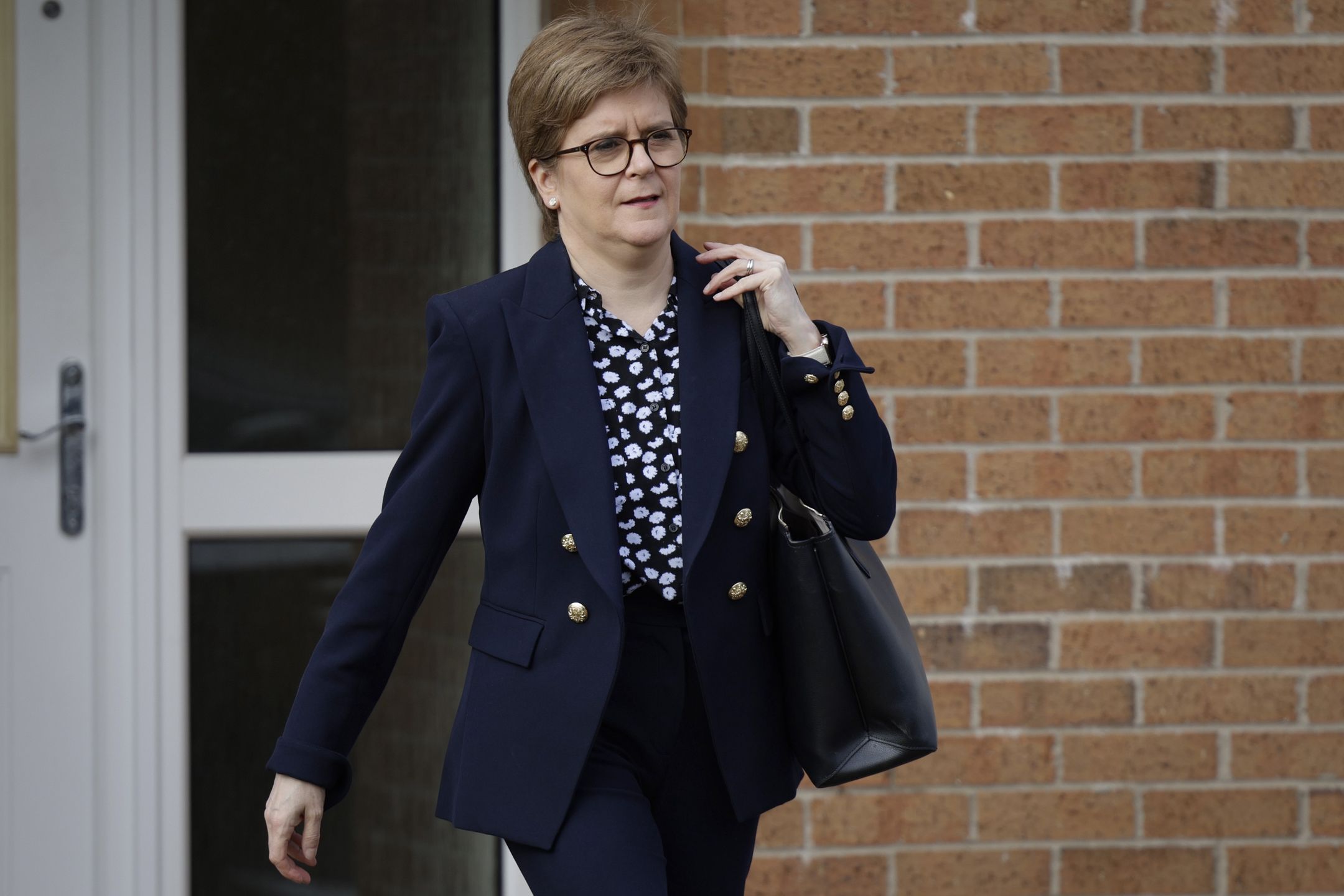 GLASGOW, SCOTLAND - APRIL 26: Nicola Sturgeon, former First Minister of Scotland, leaves her house on April 26, 2023 in Glasgow, Scotland. Police are investigating the Scottish National Party's funding and finances with both party chair, Peter Murrell (husband of former leader Nicola Sturgeon) and party treasurer, Colin Beattie, having been arrested, questioned and released.  (Photo by Jeff J Mitchell/Getty Images)