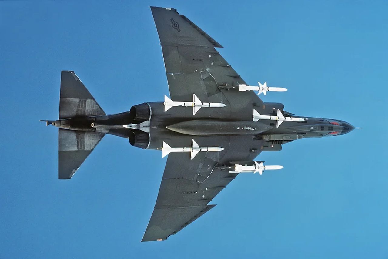 F-4 Phantom aircraft armed with three AIM-7 Sparrow missiles placed under the fuselage and two AGM-45A Shrike under the wings.