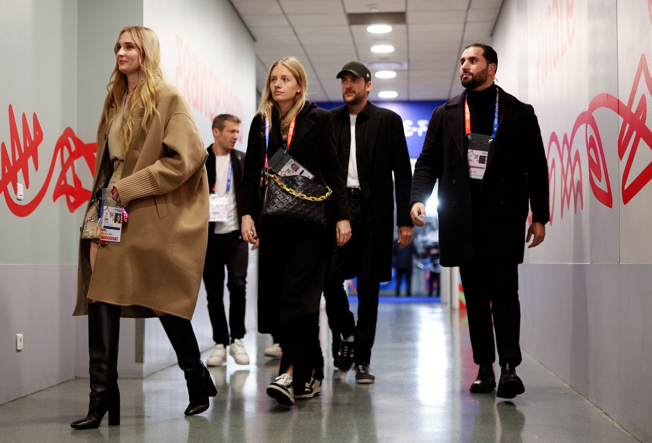 Sophie Turner and Peregrine Pearson at the stadium in Paris