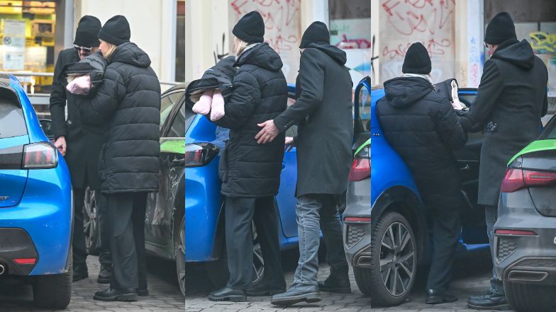 Krzysztof Ibisz przechodzi z żoną i córką na czerwonym świetle