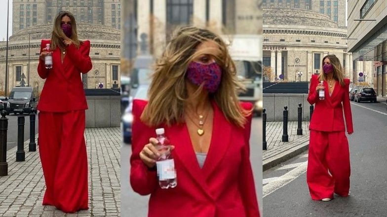 Małgorzata Rozenek włóczy szerokimi spodniami pod Pałacem Kultury, reklamując butelkę wody (ZDJĘCIA)