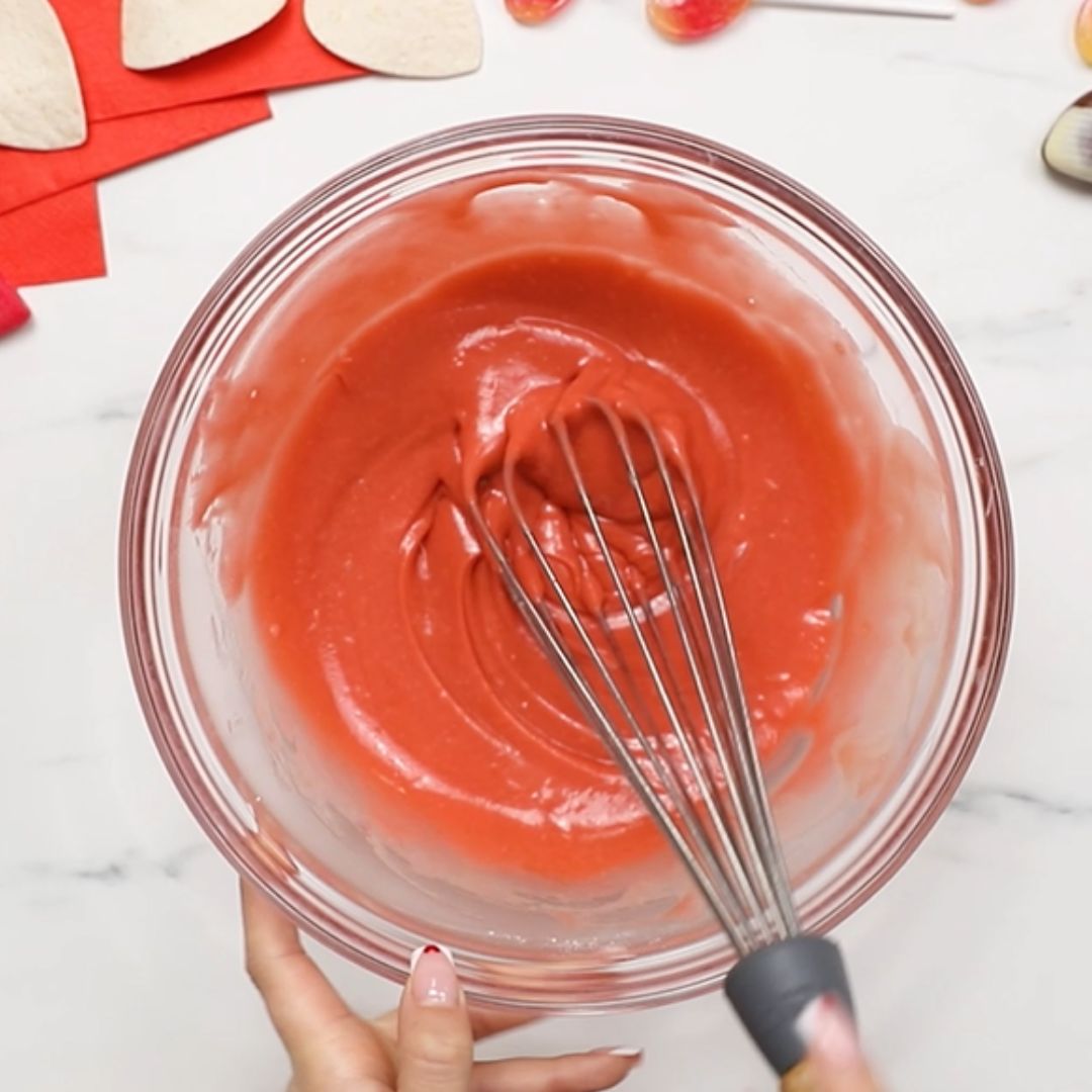 The cake gets red blushes thanks to the dye.