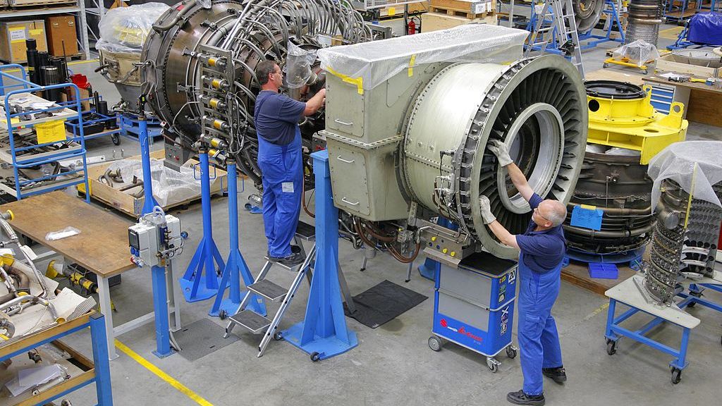 Workers assemble an aircraft jet engine at the MTU Aero engi
GERMANY - AUGUST 23:  Workers assemble an aircraft jet engine at the MTU Aero engines factory in Ludwigsfelde, Germany, Wednesday, August 23, 2006.  (Photo by Jochen Eckel/Bloomberg via Getty Images)
Bloomberg