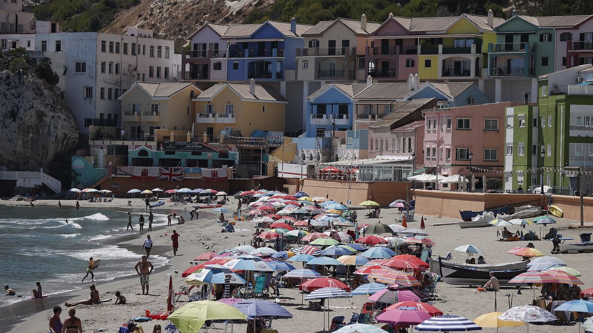 GIBRALTAR, UNITED KINGDOM - SEPTEMBER 06: A view of the beach in Gibraltar, a tiny British overseas territory located on the southern tip of the Iberian Peninsula, on September 06, 2021 in Gibraltar, United Kingdom. It is home to around 32,000 people and has the 5th highest density of any country or territory in the world. It has no land borders with any country besides Spain. In January Spain and the United Kingdom reached a last-minute preliminary deal on the status of post-Brexit Gibraltar. In the 2016 Brexit referendum, 96% of voters in Gibraltar opted to remain in the EU. Gibraltar is on the UNâs list of ânon-self-governing territoriesâ.The United Nations defines non-self-governing territories as those "whose people have not yet attained a full measure of self-government."The sovereignty of the autonomous region of Gibraltar was transferred by Spain to England with the Treaty of Utrecht signed in 1713. While Spain argues that there is no provision regarding the strait and territorial waters in this agreement, England claims that Gibraltar was left to itself as a whole.While Spain justifies the UN resolutions on territorial integrity and decolonization on the Gibraltar issue, the UK argues that the peninsula has the right to determine its own political status.When it entered the European Economic Union in 1973, Gibraltar was also included as a European territory whose foreign relations were dependent on Britain. Gibraltar is excluded from the EU's Customs Union, tax treaties, and the Common Agricultural Policy.Gibraltar's economy relies on "off-shore" banking, online betting, and tourism.Llanito, spoken in Gibraltar, is a bizarre mix of Andalusian Spanish and English, along with spatterings of Portuguese and Maltese words, others of Genoese medieval dialect, and even some of Hebrew origin.It has the southernmost mosque in Europe. (Photo by Burak Akbulut/Anadolu Agency via Getty Images)