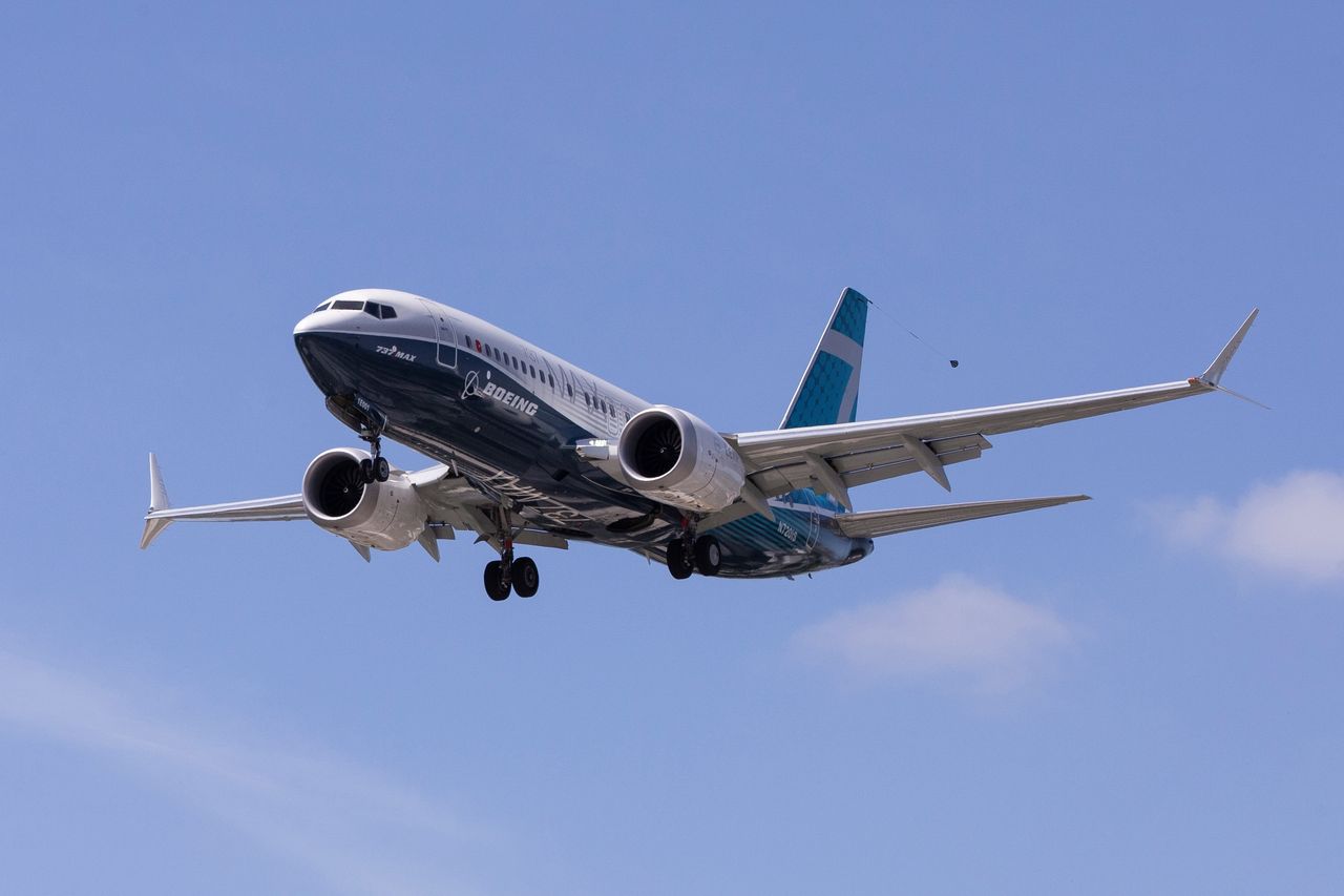 A Boeing 737 MAX airplane lands after a test flight at Boeing Field in Seattle, Washington, U.S. June 29, 2020.