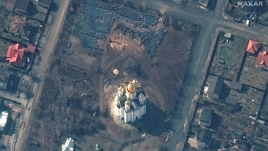 RUSSIANS INVADE UKRAINE -- MARCH 31, 2022:  02 Maxar satellite imagery closer view of probable grave site and the church of St. Andrew and Pyervozvannoho, bucha Ukraine.  31march2022wv3.   Please use: Satellite image (c) 2022 Maxar Technologies.