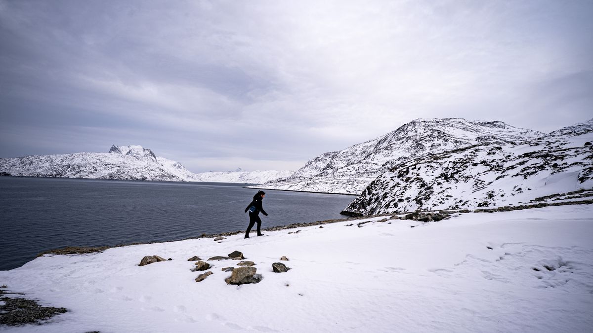 People go for a walk on a snowy path up the mountains in Nuuk, Greenland. US president Donald Trump has backed down on his threat to impose tariffs on the UK and other Nato allies who opposed his ambitions to annex Greenland. Picture date: Saturday January 24, 2026. (Photo by Ben Birchall/PA Images via Getty Images)