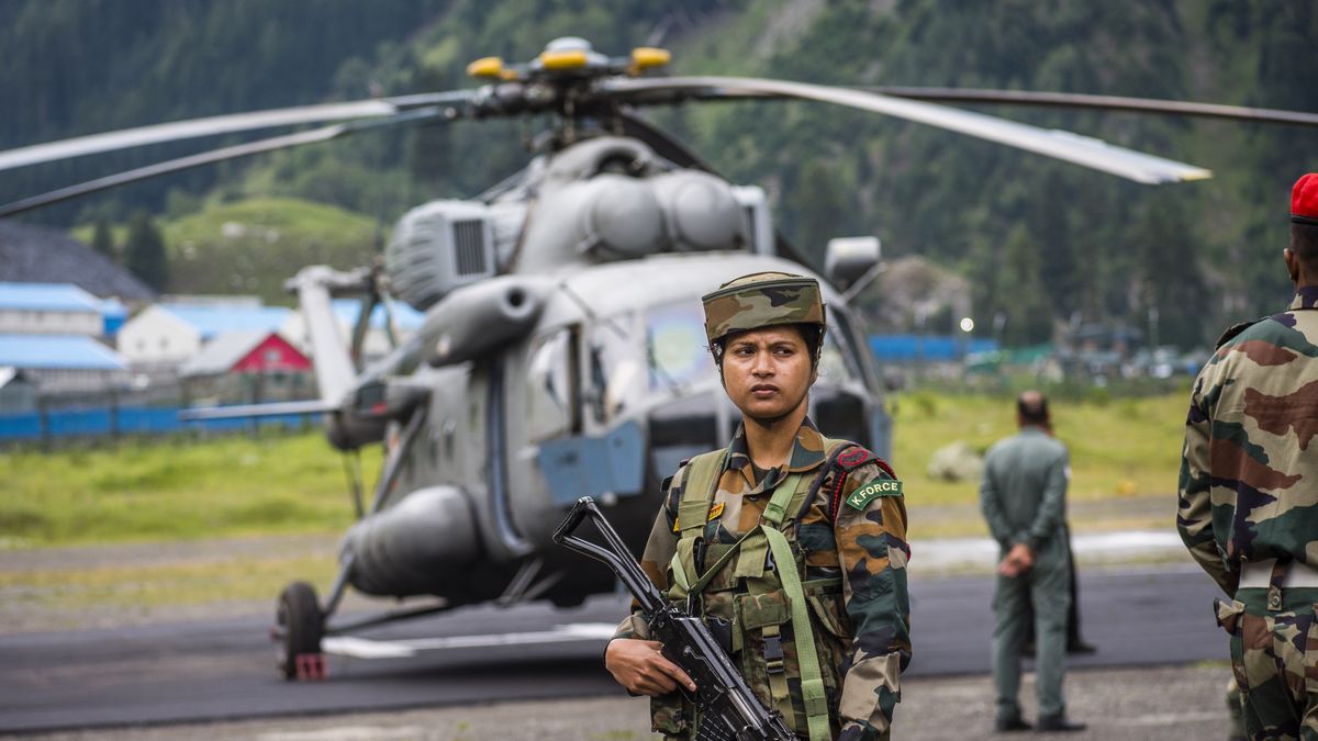 Kashmir Hit By Flash Floods
BALTAL, KASHMIR, INDIA - JULY 9: An Indian army soldier stands guard near her chopper carrying injured Indian pilgrims after flash floods on July 9, 2022 in Baltal 100 km east of Srinagar, Indian administered Kashmir, India. Flash floods triggered by a cloudburst near the base camp of the holy cave shrine of Amarnath in south Kashmir on Friday swept away scores of people, killing at least 16 pilgrims while more than 40 others are feared missing. Indian Military forces continued the rescue and searches for the missing Indian pilgrims after flash floods and landslides that swamped through tents and community kitchens on Friday evening. Dozens of injured people have been shifted to nearby hospitals while many people are believed to be still trapped under the debris. The 43-day Hindu Amarnath Pilgrimage is being held after a gap of three years. The annual pilgrimage, which began on June 30, has been suspended following the catastrophe and a decision on its resumption will be taken after rescue operations get over, a senior administration official said, Senior officials said. (Photo by Yawar Nazir/Getty Images)
Yawar Nazir