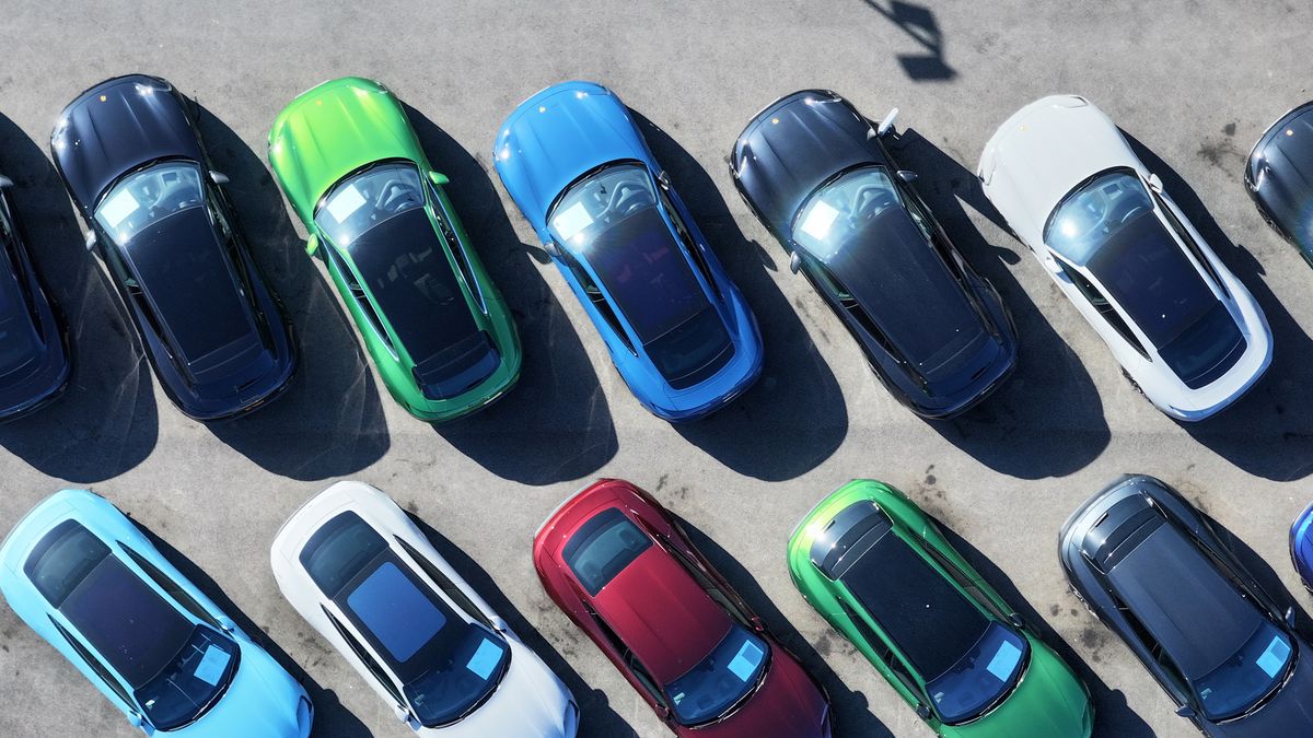 ELLESMERE PORT, ENGLAND - SEPTEMBER 21: In this aerial view, new and secondhand cars are seen for sale on a dealership forecourt on September 21, 2023 in Ellesmere Port, England. The Prime Minister has announced the postponement of several "green" targets, including a delay of the ban on selling new petrol and diesel cars in the UK. Previously, the ban was to come into effect in 2030, and now will be 2035. (Photo by Christopher Furlong/Getty Images)