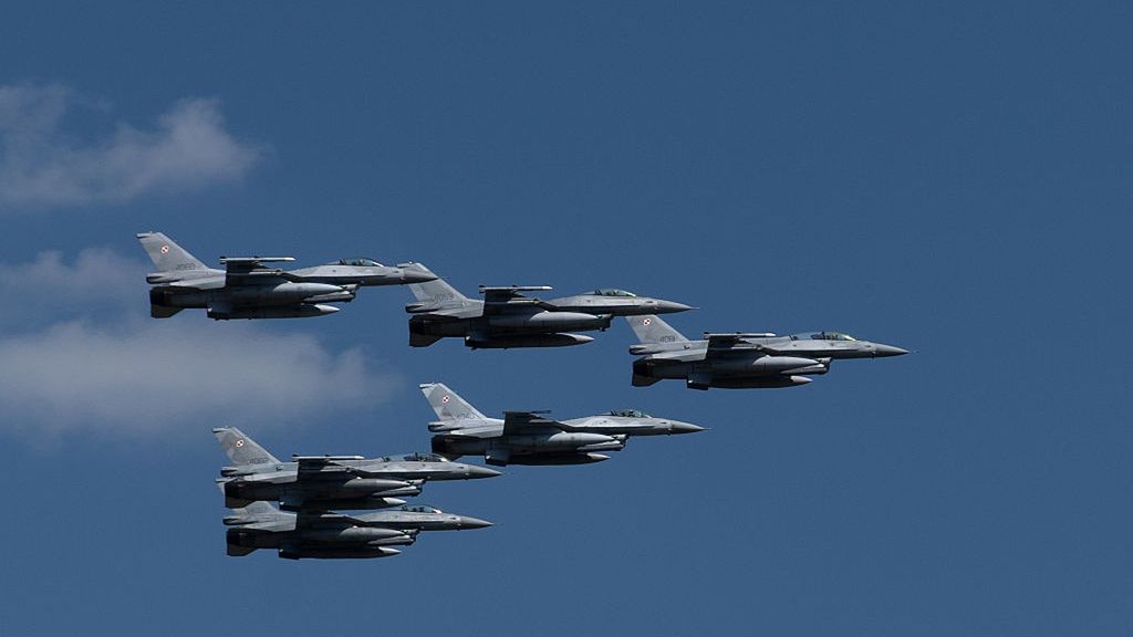 F-16 are seen during a military parade on Polish Army Day
WARSAW, POLAND - 2025/08/15: F-16 are seen during a military parade on Polish Army Day. On August 15, 2025, a ceremonial military parade was held over Warsaw to mark Polish Armed Forces Day. The event featured soldiers, mechanized units, tanks, and a variety of armoured vehicles. The highlight was an aerial flyover, with numerous aircraft from the Polish Air Force as well as allied Western air forces appearing in the skies above the capital. (Photo by Marek Antoni Iwanczuk/SOPA Images/LightRocket via Getty Images)
SOPA Images
ceremonial, skies, from polish air force, polish armed forces day, f-16, airforce, polish, western air forces, aircraft