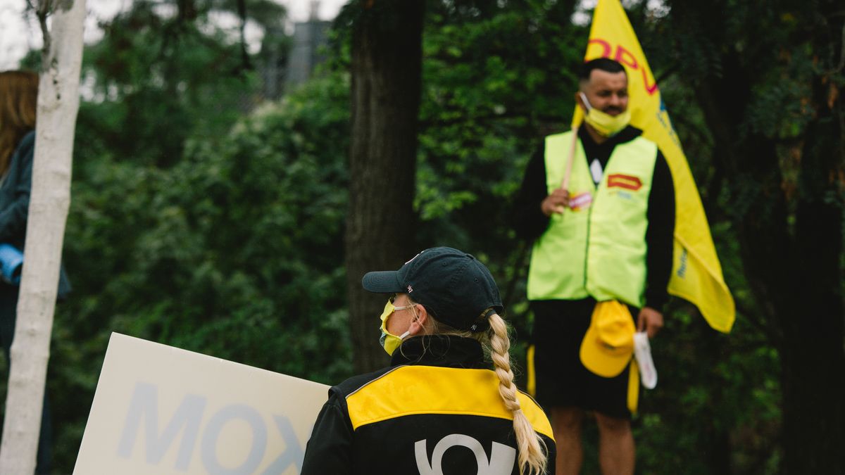 A protest wears deutsche post uniform during the protest in front of Post Tower in Bonn, Germany, on September 3, 2020. (Photo by Ying Tang/NurPhoto via Getty Images)
