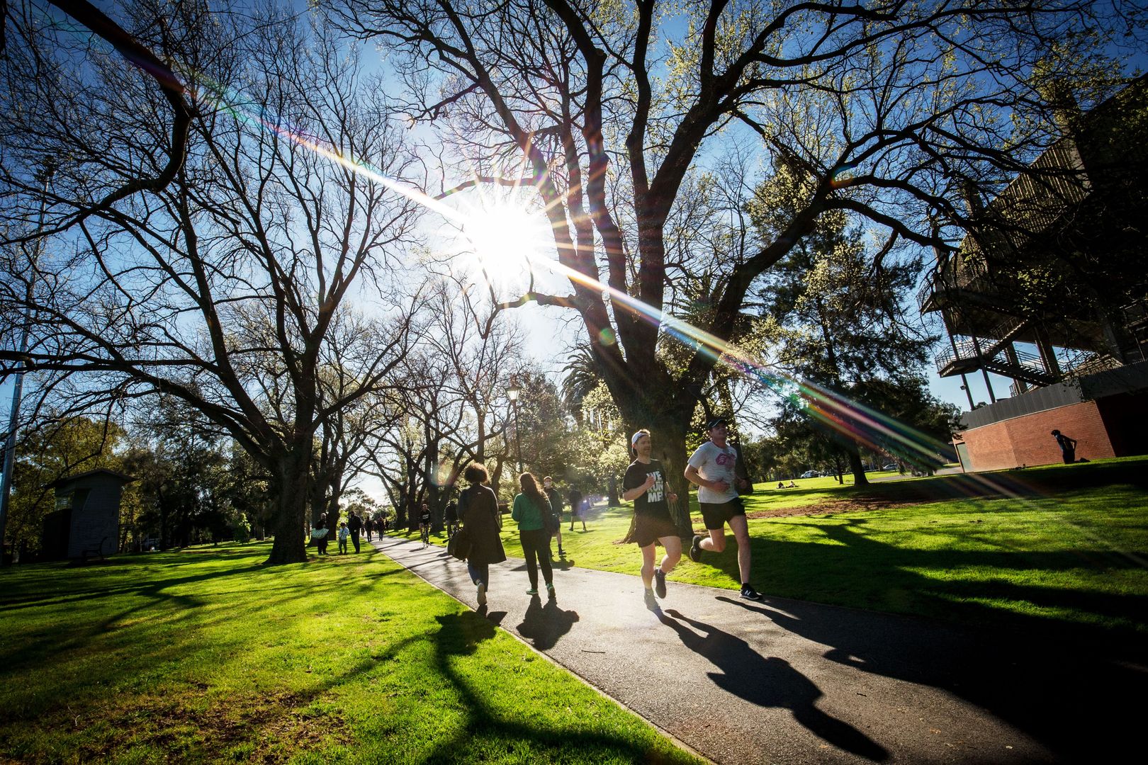 MELBOURNE, AUSTRALIA - SEPTEMBER 27: People enjoy exercise in the afternoon sun at Princes Park in Carlton on September 27, 2020 in Melbourne, Australia. Victoria has recorded 16 new coronavirus cases and 2 deaths in the past 24 hours. Premier Daniel Andrews announced an easing in Melbourne’s restrictions from tomorrow, with the curfew to be lifted, primary school students to return to the classroom in early October and up to five people will be allowed to gather outdoors. Metropolitan Melbourne has remained under stage 4 lockdown restrictions, with people only allowed to leave home to give or receive care, shopping for food and essential items, daily exercise and work while an overnight curfew from 8pm to 5am has been in place. The majority of retail businesses are also closed. Other Victorian regions are in stage 3 lockdown. The restrictions, which came into effect from 2 August, were introduced by the Victorian government as health authorities worked to respond to a second wave of community COVID-19 transmissions across the state. (Photo by Darrian Traynor/Getty Images)