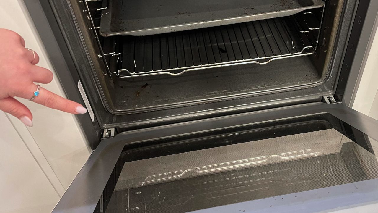 A hidden button in the door makes cleaning the oven much easier.