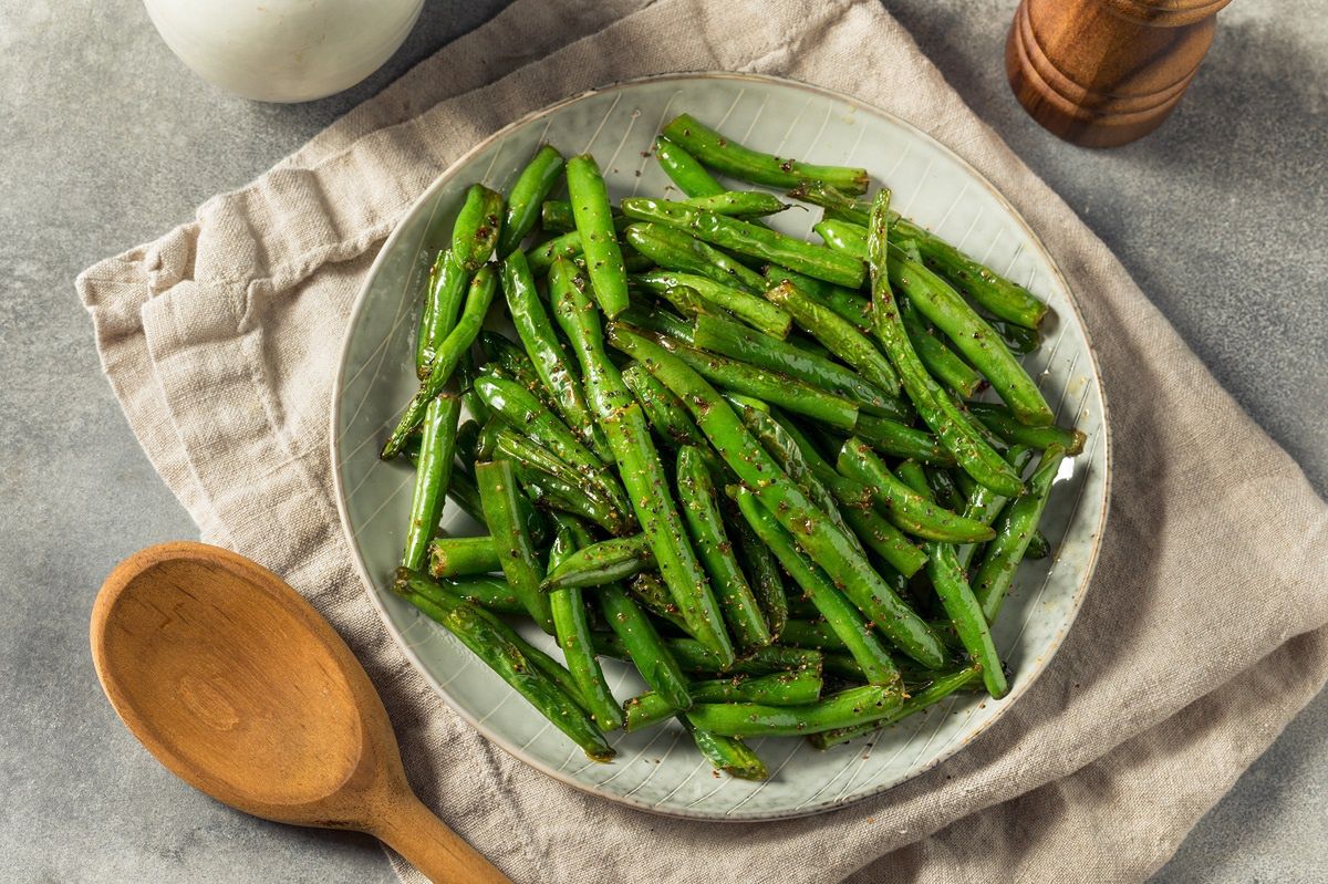 Add to cooking. The green beans will retain their beautiful color and be even more delicious.