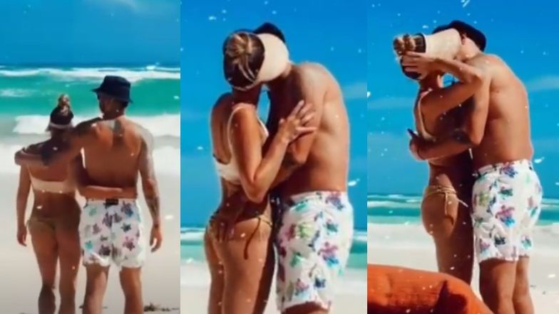 Zakochane Majdany całują się na tle oceanu