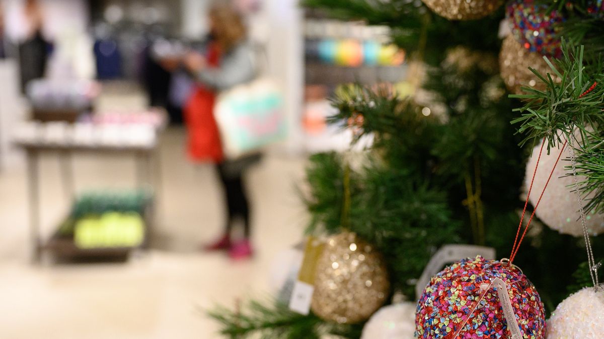 LONDON, ENGLAND - OCTOBER 20: A customer browses some of the festive items in the Christmas gift and decoration section in the branch of retailer Marks and Spencer at Westfield White City on October 20, 2020 in London, England. The high street store has announced that searches for Christmas-related items have tripled on previous years. The British Retail Consortium (BRC) has launched a new “Shop early, Start wrapping, Enjoy Christmas” national campaign, encouraging British consumers to start their festive shopping early. The aim is to both spread the amount of footfall in stores to aid social distancing, and to ensure that retail stores survive the Christmas period, despite COVID-19 preventative measures. (Photo by Leon Neal/Getty Images)