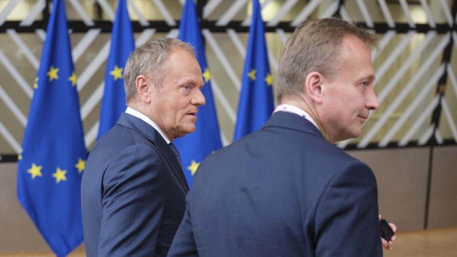 BRUSSELS, BELGIUM - JUNE 27: Polish Prime Minister Donald Tusk talks to the media in the Europa building on June 27, 2024 in Brussels, Belgium. The meeting will be an opportunity to discuss the situation on the ground, but also take note of some achievements since the last meeting. Polish PM is flanked by the Acting Permanent Representative of Poland Piotr Serafin. (Photo by Thierry Monasse/Getty Images)