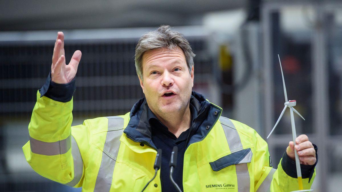 CUXHAVEN, GERMANY - JANUARY 31: German Federal Economy and Climate Action Minister Robert Habeck holding a model wind turbine while visiting the Siemens Gamesa wind turbine factory on January 31, 2023 in Cuxhaven, Germany. Siemens Gamesa specialises in wind turbines for offshore wind parks. (Photo by Gregor Fischer/Getty Images)