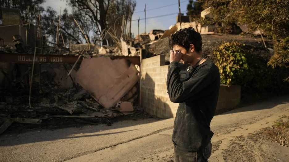 Temporary
Oliver Braren wipes his eyes as he takes a moment from sifting through Kaegan Baron's mother's home after it was destroyed by the Palisades Fire in the Pacific Palisades neighborhood of Los Angeles, Saturday, Jan. 11, 2025. (AP Photo/John Locher)
John Locher