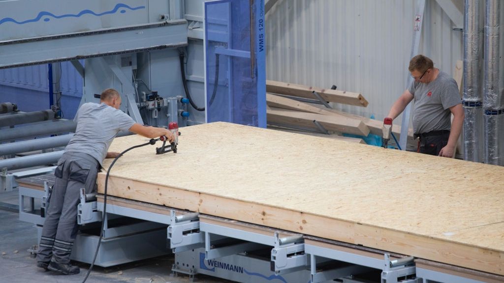 End Of Cheap Labor Era Leaves Poles Scrambling To Find Workers
Workers use nail guns to prepare wall sections for pre-fabricated homes at the Danwood SA factory in Bielsk Podlaski, Poland, on Thursday, Aug. 23, 2017. Its the end of an era of cheap and ample labor that underpinned their transition from communism, with growing complaints that a labor dearth is threatening to foil production plans. Photographer: Piotr Malecki/Bloomberg via Getty Images
Bloomberg
Brexit2016, Development, House Building, EMEA, EAME, Property, Industry, UK Vote on EU Membership, Homes, Manufacturing, Construction Workers, Fabrication, Real Estate, Europe, Construction, E.U., EU