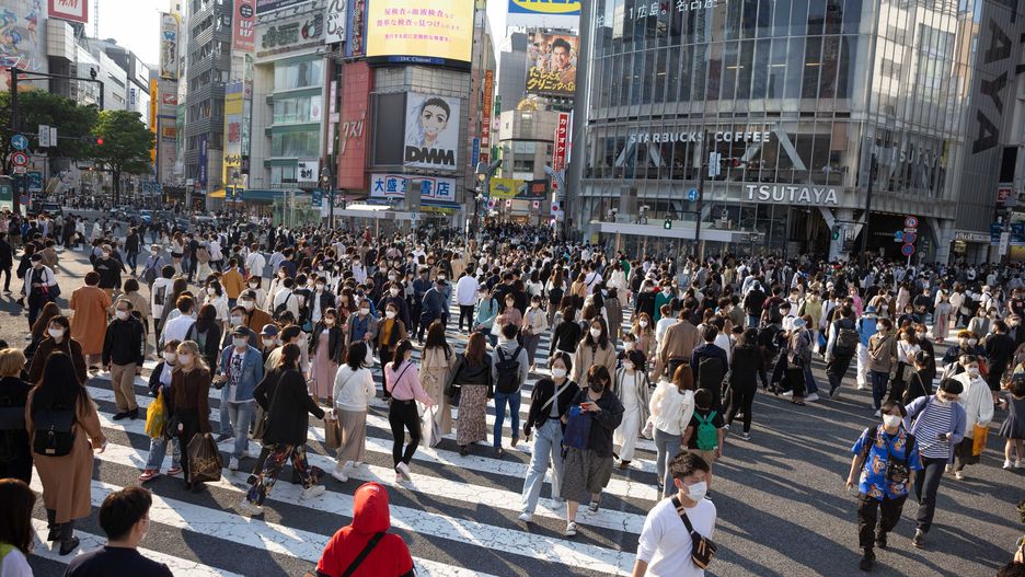 TOKYO, JAPAN - 2022/05/03: Pedestrians walk over Shibuya crossing during the Golden Week. Golden Week in Japan is a collection of four national holidays within seven days. In combination with well placed weekends, it becomes one of Japan's three most favorite holiday seasons, besides New Year and the Obon week. (Photo by Stanislav Kogiku/SOPA Images/LightRocket via Getty Images)