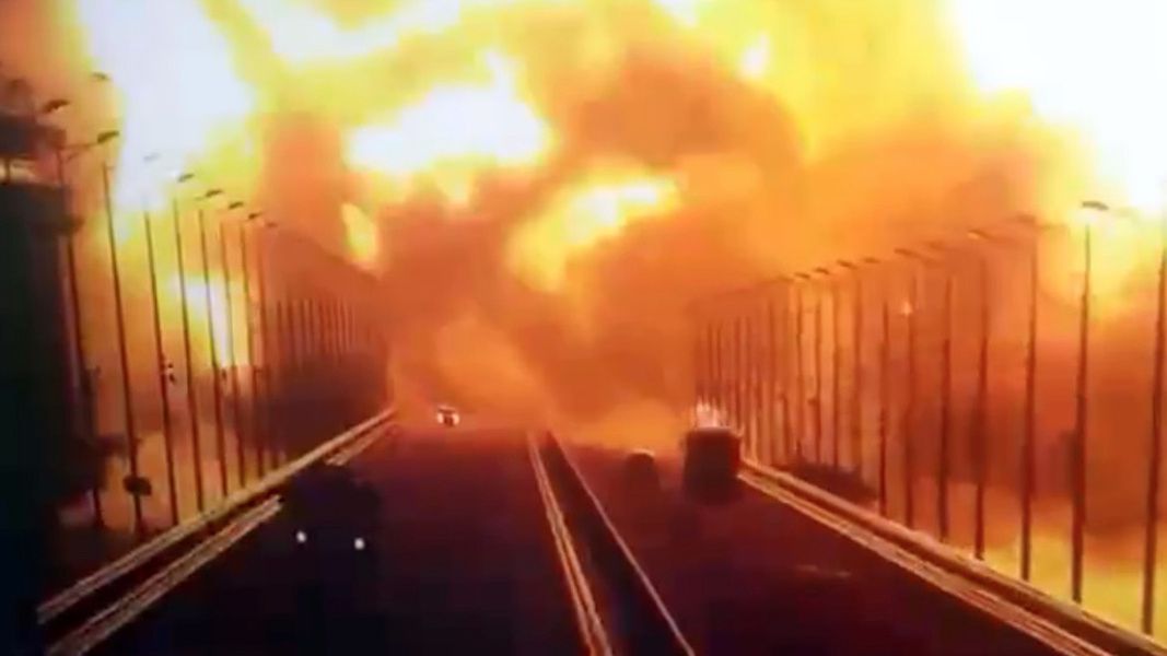 CRIMEA - OCTOBER 08: A screen grab from a surveillance footage shows flames and smoke rising up after an explosion at the Kerch bridge in the Kerch Strait, Crimea, October 8, 2022. A bridge connecting Crimea to Russia caught fire early Saturday morning causing suspension of traffic as all train services to Crimea temporarily suspended. The Kerch Bridge -- a pair of parallel bridges, one road and one railroad -- is a key supply route for Russia which was built after Crimea's annexation in 2014. (Photo by Security Camera/Anadolu Agency via Getty Images)