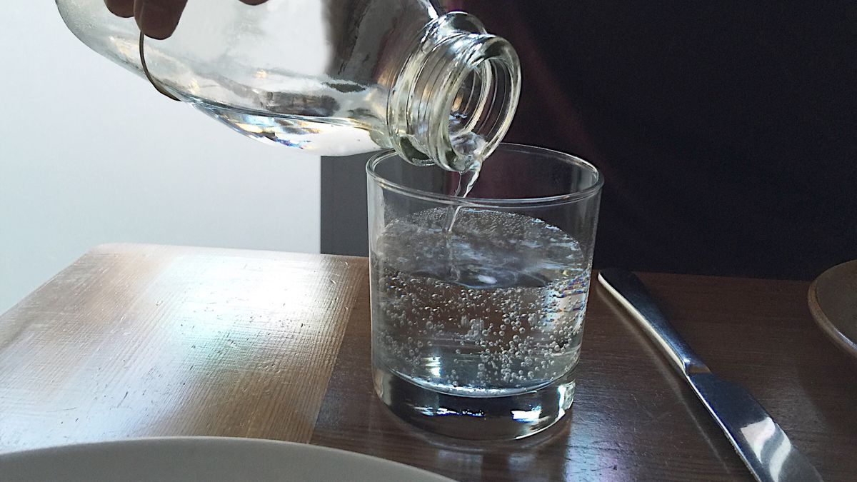 Close-Up Of Drink On TableAlice Day / EyeEmHuman Body Part, Drink, Midsection, Glass - Material, Drinking Water, Human Hand, Pouring, Drinking Glass, Non-Alcoholic Beverage, Human Finger, Filling, Place Setting, Carbonated, Knife, Surface Level, Purity, Freshness, Day, Food And Drink, Indoors, Close-Up, Plate, One Person, Wooden, Bubble, Refreshment, Table, Liquid, Water Bottle, Horizontal Image