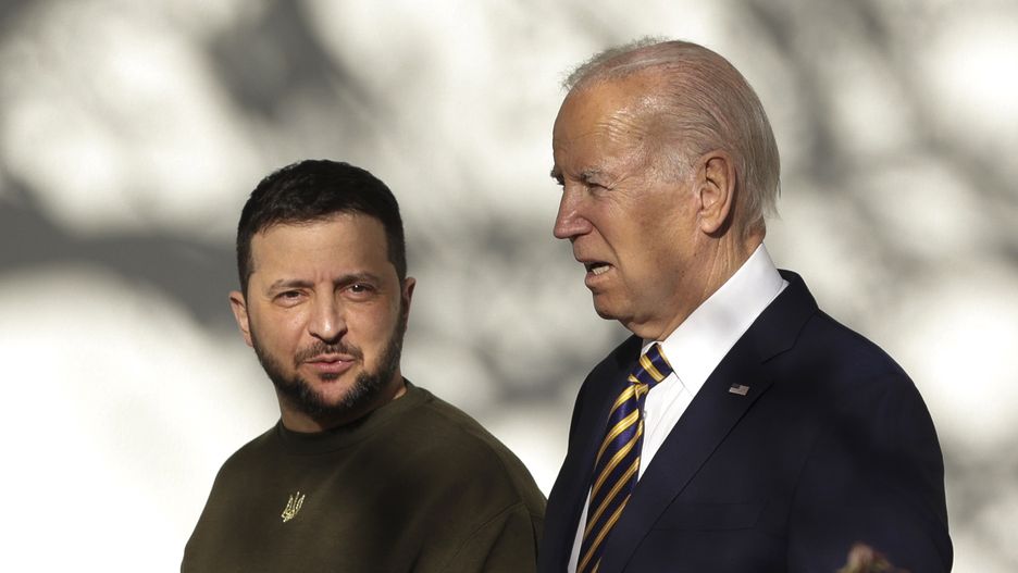 WASHINGTON, DC - DECEMBER 21: U.S. President Joe Biden (R) and President of Ukraine Volodymyr Zelensky walk down the Colonnade as they make their way to the Oval Office at the White House on December 21, 2022 in Washington, DC. Zelensky is meeting with President Biden on his first known trip outside of Ukraine since the Russian invasion began, and the two leaders are expected to discuss continuing military aid. Zelensky will reportedly address a joint meeting of Congress in the evening. (Photo by Alex Wong/Getty Images)
