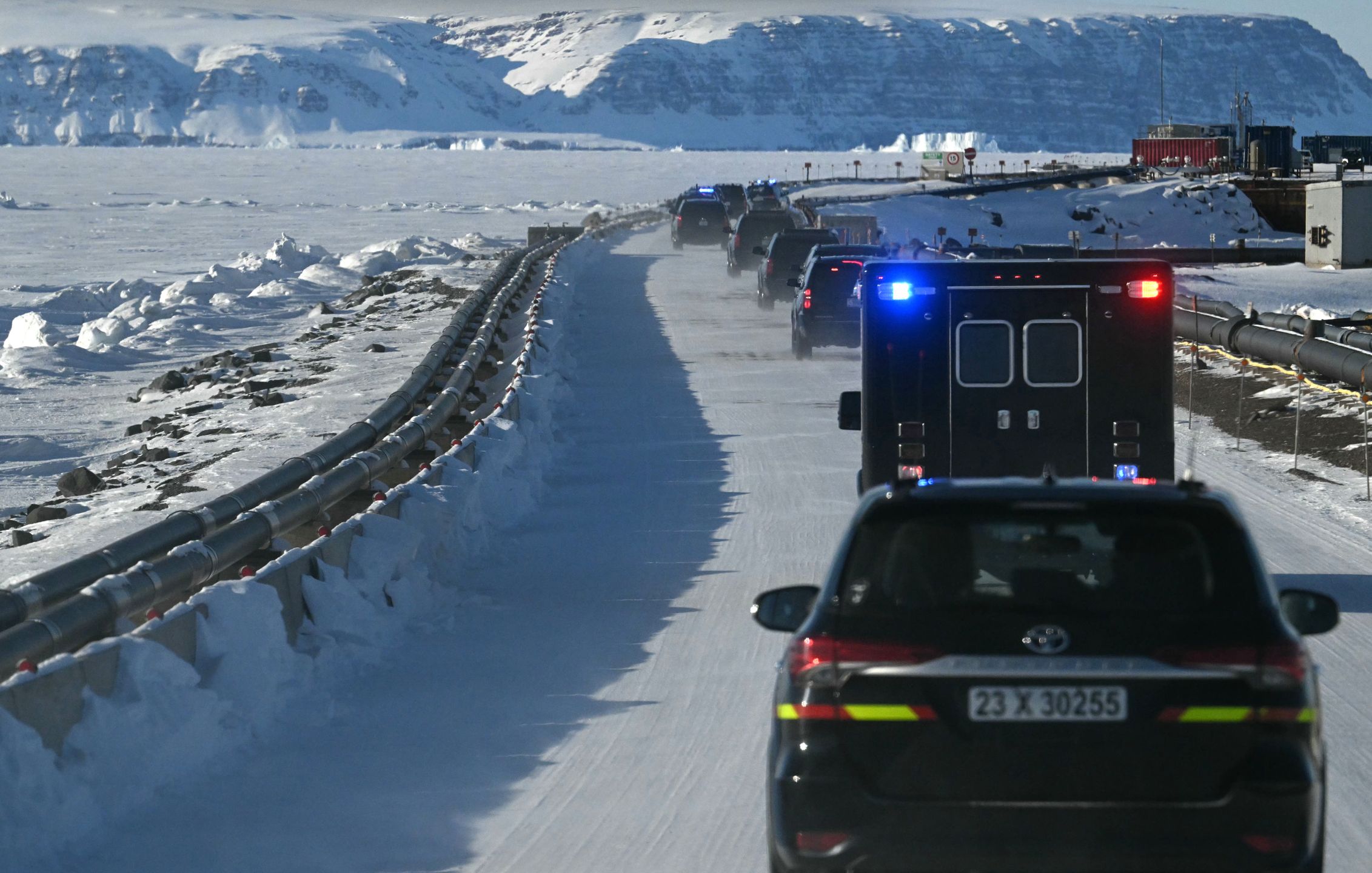 PITUFFIK, GREENLAND - MARCH 28: The motorcade of US Vice President JD Vance travels through the US military's Pituffik Space Base on March 28, 2025 in Pituffik, Greenland. The itinerary for the visit was scaled back after a plan for a more extensive trip drew criticism from officials in Greenland and Denmark, which controls foreign and defence policy of the semiautonomous territory. (Photo by Jim Watson - Pool / Getty Images)