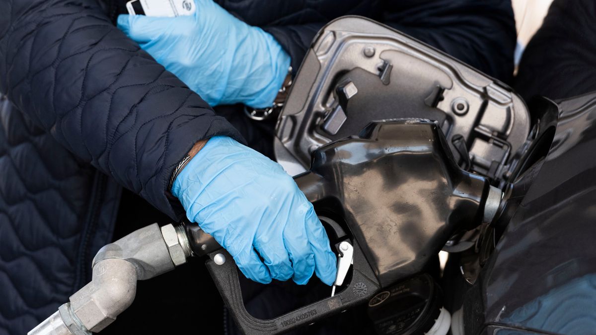 A customer wearing gloves refuels at a Kwik Trip gas station in Appleton, Wisconsin, U.S., on Tuesday, April 20, 2020. Of all the wild, unprecedented swings in financial markets since the coronavirus pandemic broke out, none has been more jaw-dropping than Mondays collapse in a key segment of U.S. oil trading. Photographer: Lauren Justice/Bloomberg via Getty Images