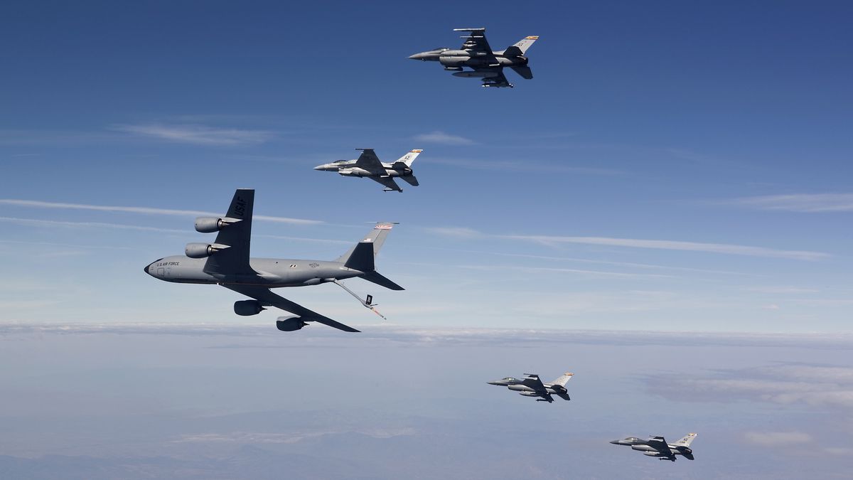 Four F-16's and a KC-135 from the Arizona Air National Guard fly in formation during a training mission over Southern Arizona.HIGH-G Productions/Stocktrek Imaaerial refueling, air force, air national guard, air superiority fighter, air-to-air, airborne, aircraft, airplane, arizona, attack aircraft, color image, combat aircraft, connection, cooperation, day, f-16, f-16 fighting falcon, fighter jets, fighter planes, five objects, flight, flying, formation, horizontal, jet, jetfighter, kc-135, kc-135 stratotanker, military, mission, motion, multirole combat aircraft, no people, on the move, outdoors, performance, photography, plane, precision, refueling, side view, sky, stratotanker, tanker, togetherness, transportation, us air force