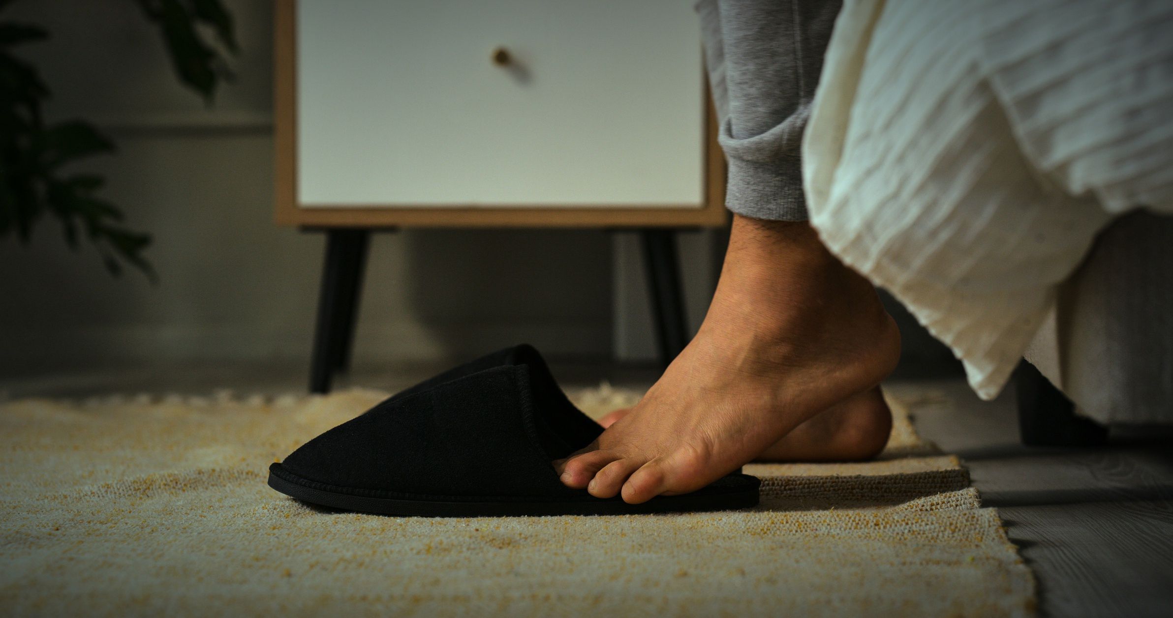 Slippers, morning and feet of person by bed for routine to start day, getting ready and wake up. Floor, home and closeup of comfortable, warm and soft shoes in bedroom for walking in apartment
Slippers, morning and feet of person by bed for routine to start day, getting ready and wake up. Floor, home and closeup of comfortable, warm and soft shoes in bedroom for walking in apartment
DMP
