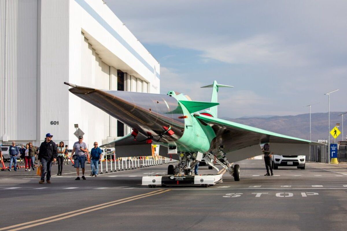 The experimental NASA X-59 leaves the Lockheed Martin hangars.