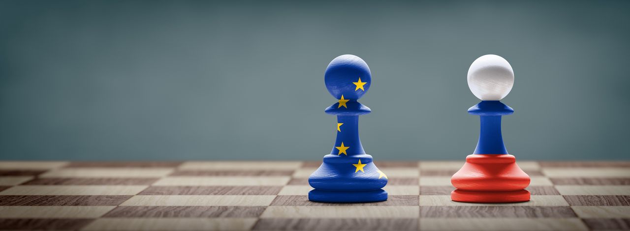 European Union and Russia conflict. Flags on chess pawns on a chess board. 3D illustration.